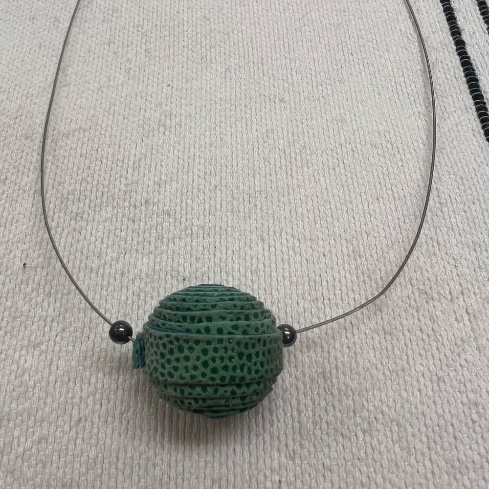 Handmade artisanal leather beaded necklace. Made in Argentina.
